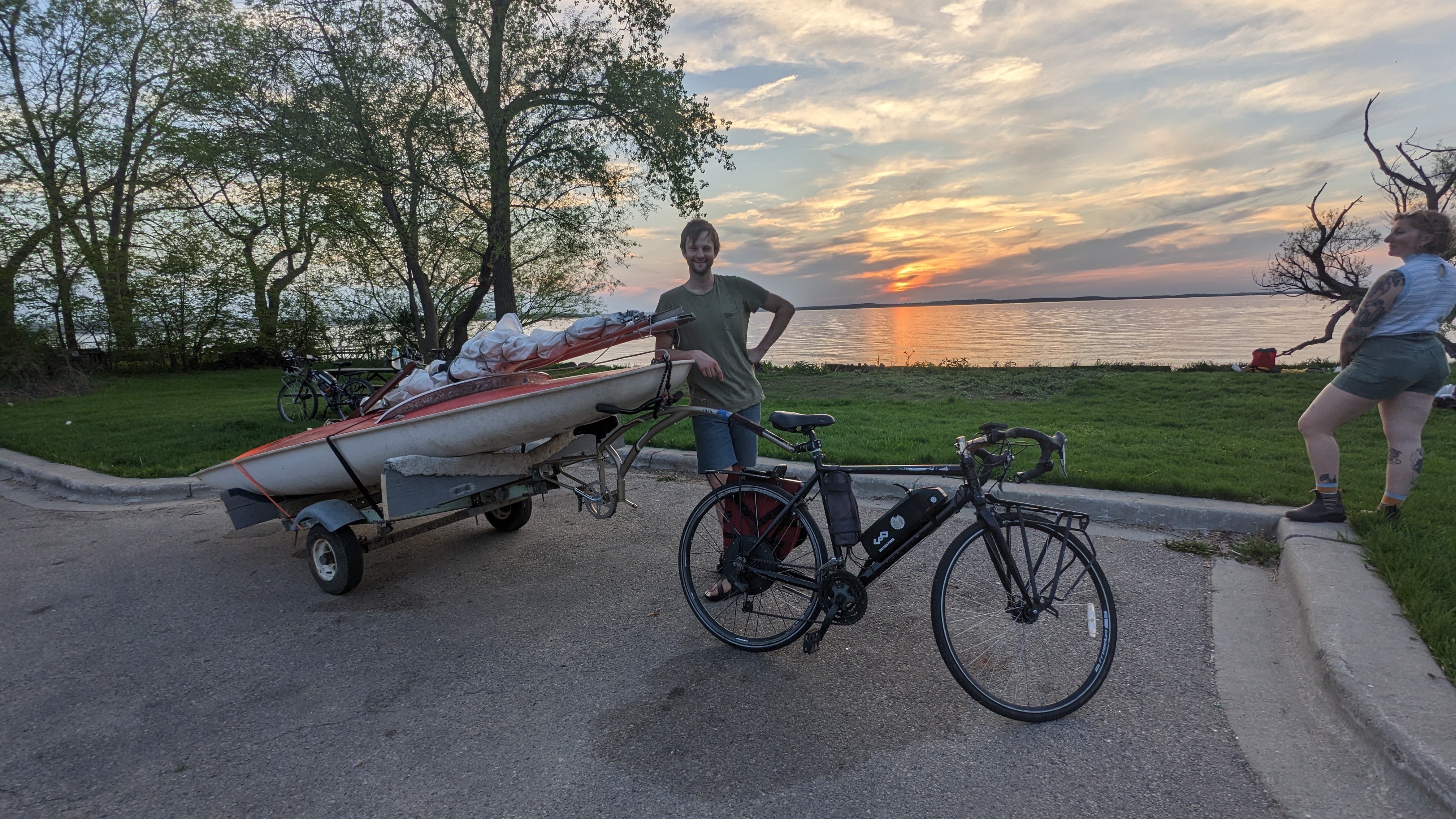 me standing with bike trailer and boat in front of Lake Mendota